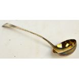 A George III hallmarked silver Old English pattern ladle with circular bowl with gilt wash interior,