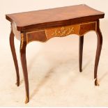 A reproduction French kingwood veneered rosewood crossbanded card table of serpentine outline