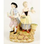 A late 19th century Meissen porcelain figure group of a female flower seller and male wine seller,