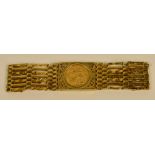 A 9ct gold pierced broad link bracelet centred with a sovereign; 1911,