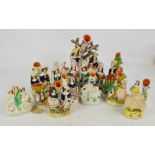 A collection of late 19th century and reproduction Staffordshire spill vases,