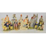 A quantity of 19th century and reproduction Staffordshire figures including cricketers.