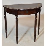 A reproduction mahogany bowfront side table with single drawer and fluted tapering legs, width 84cm.