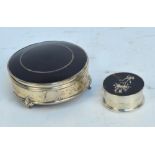 A George V hallmarked silver and tortoiseshell mounted circular trinket box with hinged lid and