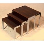 MERROW ASSOCIATES; a nest of three rosewood and chrome mounted rectangular occasional tables,