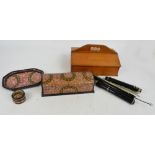 A cutlery box, a small quantity of cutlery, a clarinet and a lacquered dome topped box,