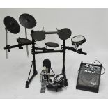 A Roland electric drum set with amplifier. CONDITION REPORT: Heavy wear. Model no.TD-6V. We are