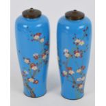 A pair of Japanese Meiji period cloisonné enamel vases depicting branches of blossoming prunus on