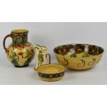 T.G.G & CO LTD; a three piece "Ivanhoe" toilet set and a Royal Doulton jug (4).