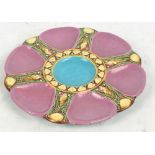 A Minton majolica oyster dish, with six pink glazed outer recesses, impressed marks, no.1323,