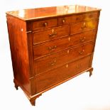 A large George IV mahogany chest, the moulded top above three frieze drawers,