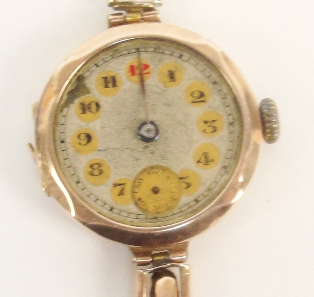 A 9ct rose gold cased lady's wristwatch, the dial set with Arabic numerals and subsidiary seconds