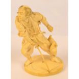 A detailed Japanese Meiji period carved ivory okimono depicting a warrior leaning forward with
