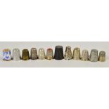 A group of twelve various thimbles including a Royal Crown Derby example, a horn example with