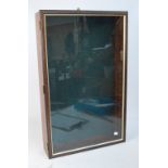 A mahogany wall display cabinet with single glazed door enclosing eight glass shelves, 76 x 47cm,