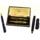 A boxed Parker Duofold fountain pen and propelling pencil, the fountain pen with 18ct gold nib in