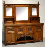 An early 20th century walnut mirror back sideboard,