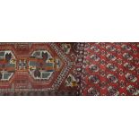 Two wool Middle Eastern red ground rugs, 43 x 29cm, 180 x 130cm (2).