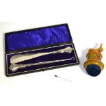 A boxed hallmarked silver shoe horn and button hook set, marks rubbed, a yellow metal stick pin,