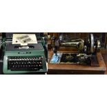 A vintage oak cased sewing machine and a Silver-Reed typewriter (2).