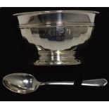 A cased George VI hallmarked silver bowl with faceted sides and footed base and a matching spoon,