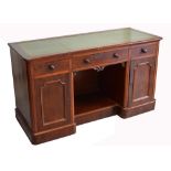 A 19th century desk with green leather inset top,