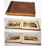 An early 20th century leather bound photograph album with gilt lettering to the front cover which