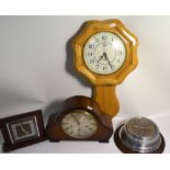 A mid 20th century Smiths oak cased mantel clock, silvered dial set with gilt Roman numerals,