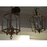 Two reproduction interior ceiling lanterns in brass and gilded metal, each with a three light