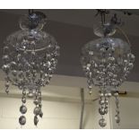 A pair of glass electroliers with glass drops, height of both 35cm (2). CONDITION REPORT Some