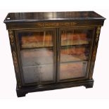 A late 19th early 20th century ebonised inlaid two door display cabinet,