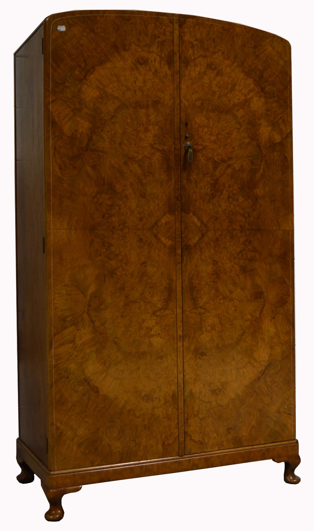 An early 20th century gentlemans walnut wardrobe of small proportions with integral compartments