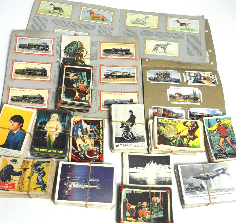 A good collection of collectors cards from the 1960s to include Batman, The Monkees,