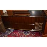 A 1950s style stereo radiogram by Grundig, length 136cm.