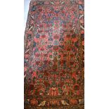 A Persian Sarough rug, 126 x 68cm. CONDITION REPORT Frayed to ends, no damage or holes.