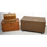 A cased Singer sewing machine, a blanket box and a large travel trunk (3).