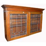 The top of an oak sideboard with twin lead astragal glazed doors, now for use as a bookcase,