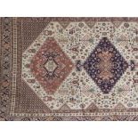 A beige ground Caucasian style rug, 190 x 140cm.