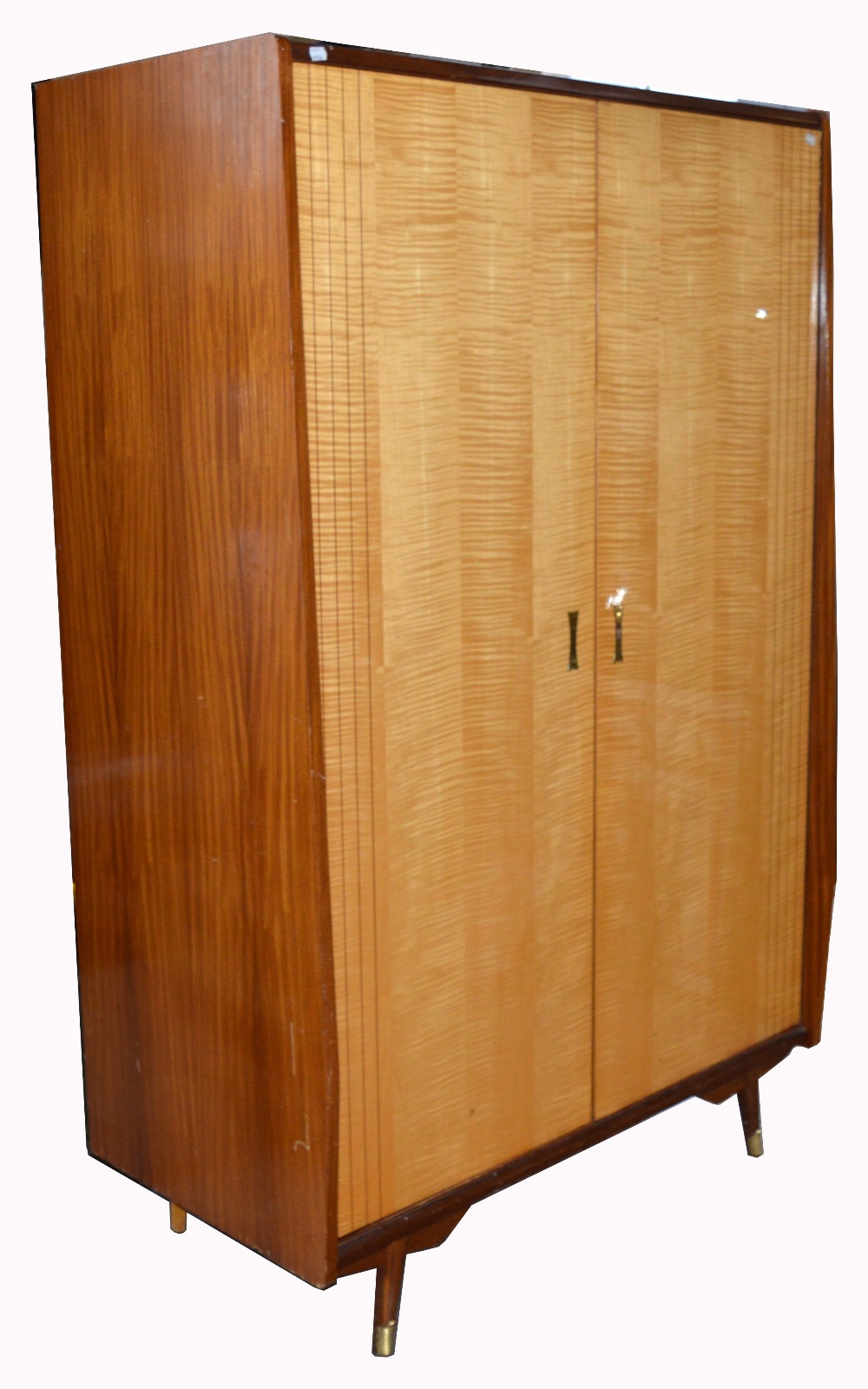 A retro 1960s twin door wardrobe on tapering block supports with integral section for shirts,