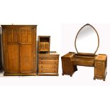 A 20th century oak priory style furniture suite comprising large twin door wardrobe, width 122cm,