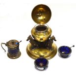 A brass inkwell, three dogs supporting a globe with lift-up top and glass liner,