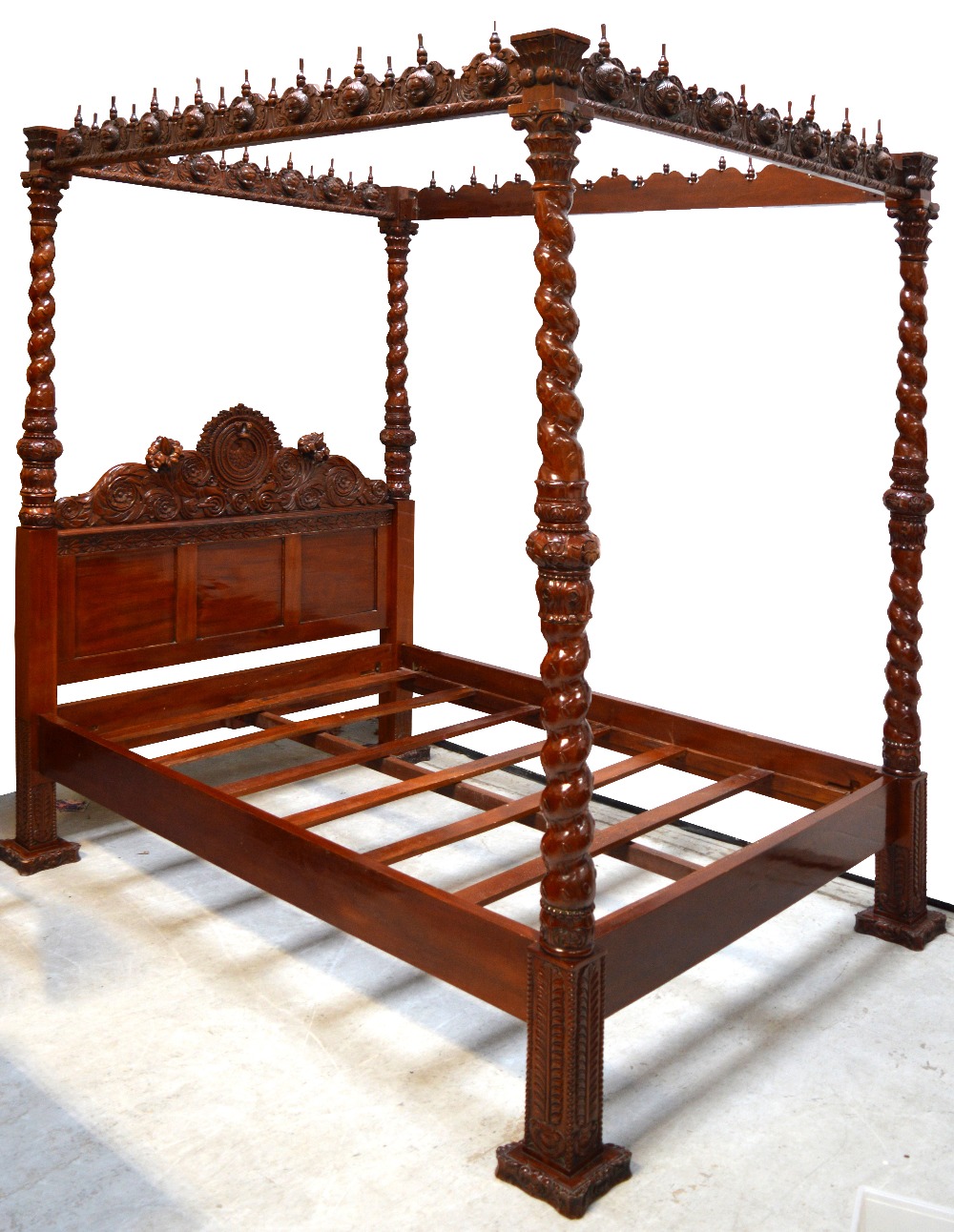 A hand carved four poster king size bed from the Somerset Guild of Carvers,