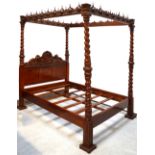 A hand carved four poster king size bed from the Somerset Guild of Carvers,