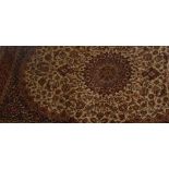 A beige ground Keshan style carpet, 230 x 160 cm.