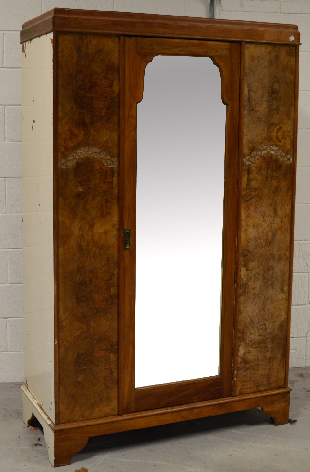 An early to mid 20th century walnut double mirror door wardrobe,