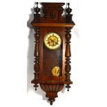 An early 20th century Viennese mahogany wall clock with gilded and enamel dial set with Roman