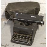 A vintage cased Olivetti typewriter.