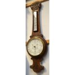 An early twentieth century oak cased barometer, length 90cm.