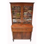 A George III mahogany secretaire bookcase, the upper twin door astragal glazed section above one