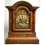 An early 20th century German fourteen day striking walnut cased mantel clock,